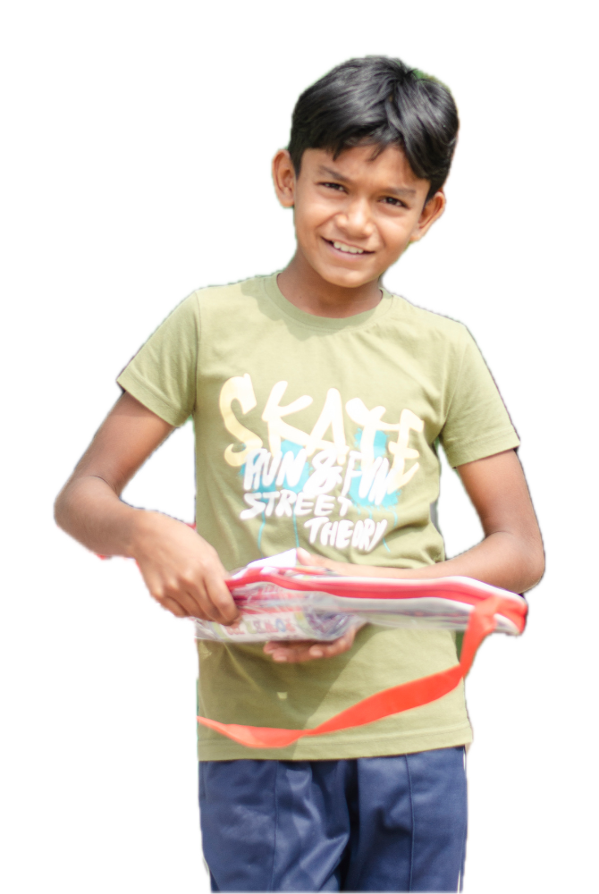 A boy with the badminton set he got at Gift a Smile