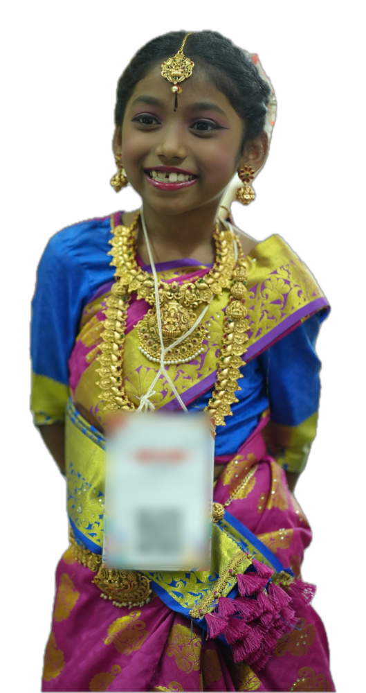 A girl in costume and jewellery, smiling, at the fancy dress event